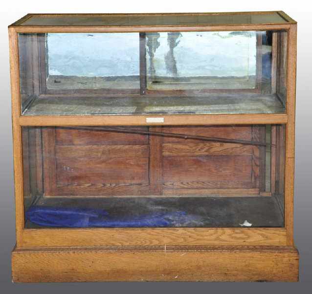 Appraisal: Large Glass Display Case with Sliding Back Doors Description Early