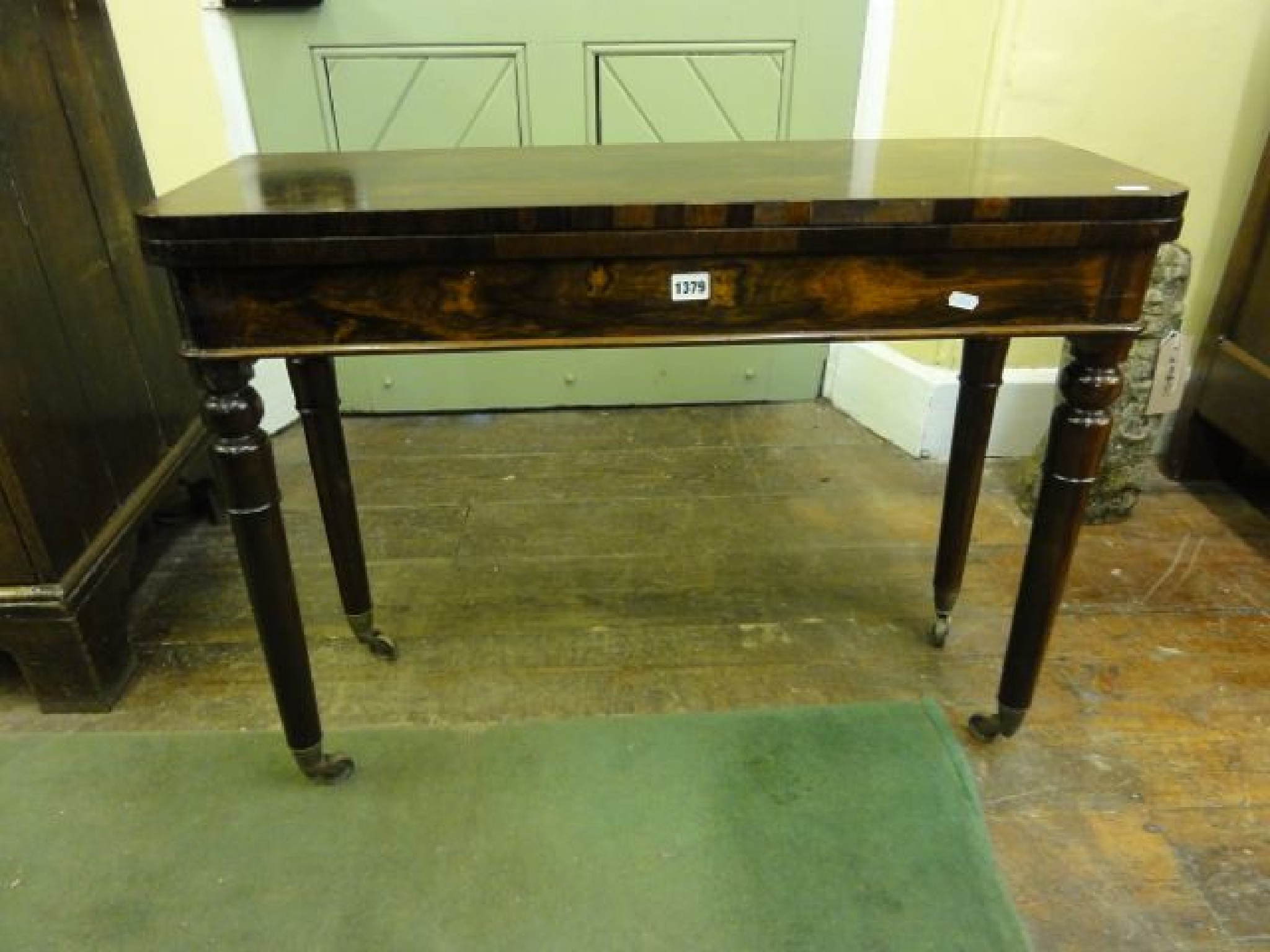 Appraisal: A Regency rosewood fold over top card table of very