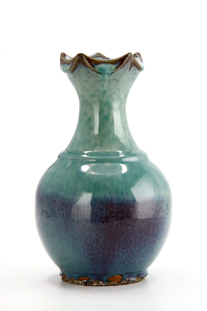 Appraisal: Chinese Flambe-Glazed Vase The robustly potted compressed globular body with