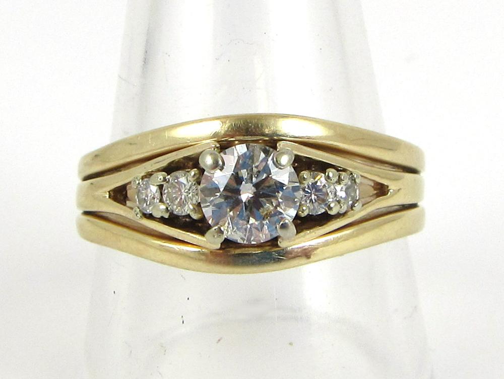 Appraisal: ESTATE DIAMOND AND FOURTEEN KARAT GOLD RING with a pair