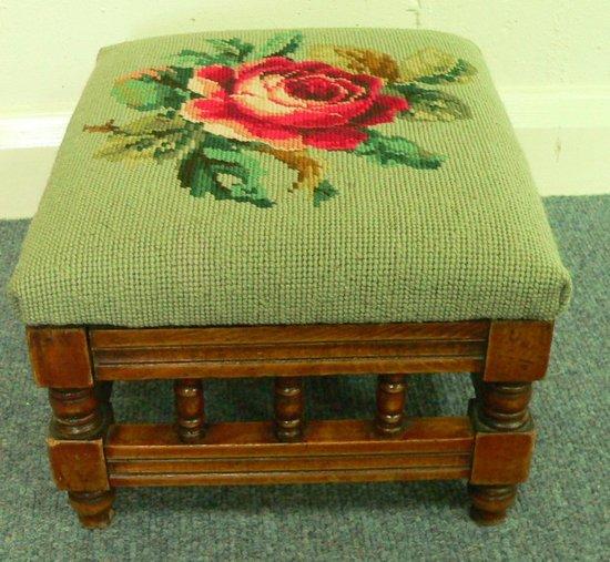 Appraisal: An early th Century footstool with galleried sides the needlework