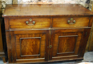 Appraisal: A th century mahogany two drawer cupboard with fielded panels