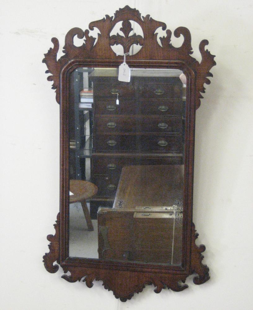 Appraisal: A GEORGIAN MAHOGANY FRET PIER GLASS the oblong plate within