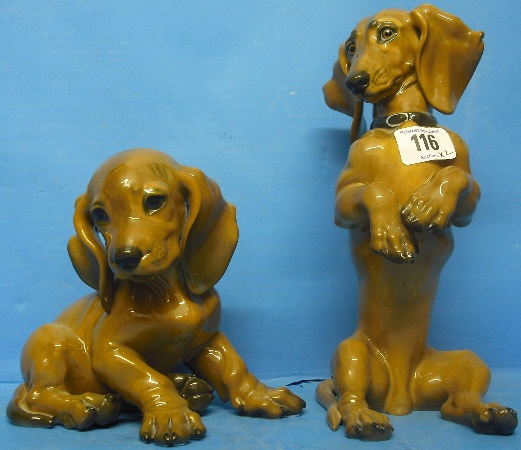 Appraisal: Rosenthal seated Dachshund height cm and seated Dachshund Puppy