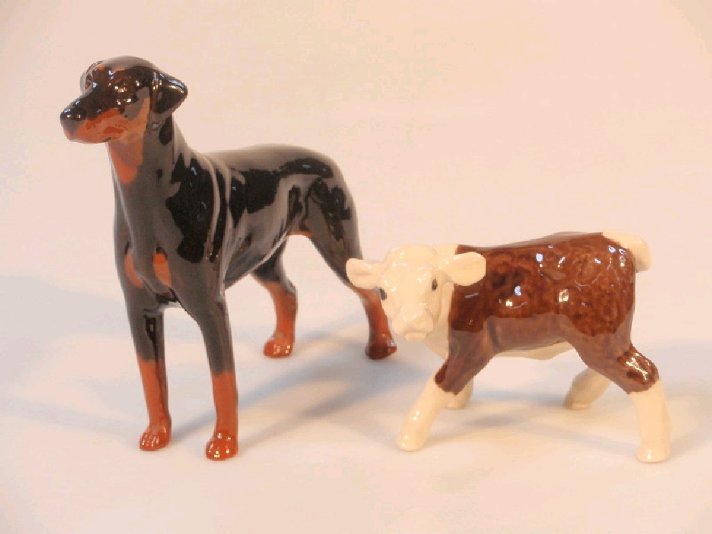 Appraisal: A Beswick figure of a Doberman and a small pottery