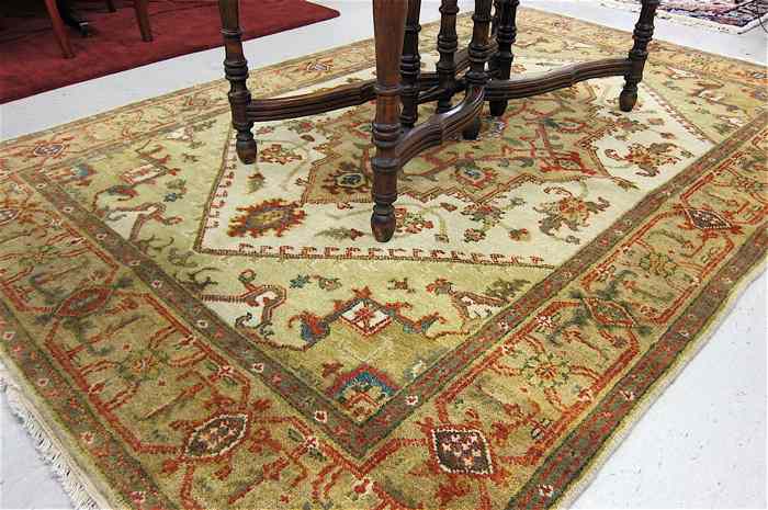 Appraisal: HAND KNOTTED ORIENTAL CARPET Indo-Persian floral and central geometric medallion