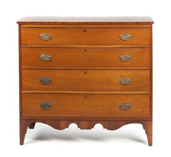 Appraisal: An American Cherry Chest of Drawers having a rectangular top