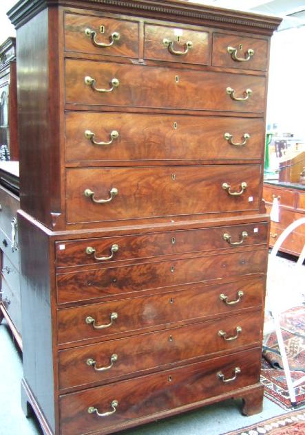 Appraisal: A George III mahogany chest on chest the canted dentil