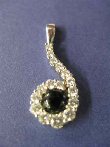 Appraisal: Platinum Diamond Sapphire Pendant dark cabochon gem surrounded by diamonds