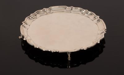 Appraisal: A silver waiter BB Birmingham with pie crust border on