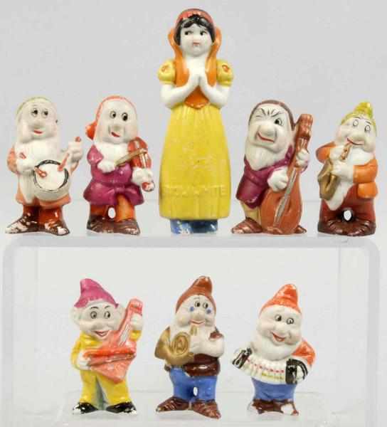 Appraisal: Set of Bisque Snow White the Dwarfs Figures Description Japanese