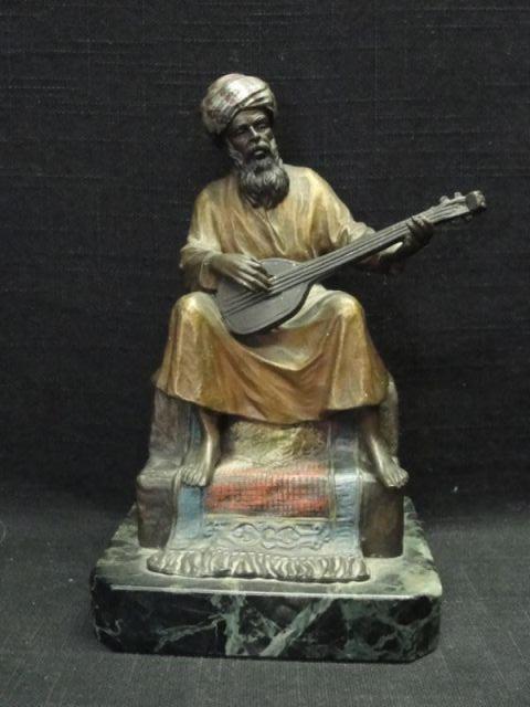 Appraisal: Vienna Patinated Bronze Arab Musician Sitting on staircase and carpet