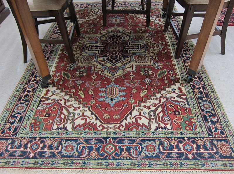 Appraisal: HAND KNOTTED ORIENTAL CARPET Persian Serapi design stylized floral and