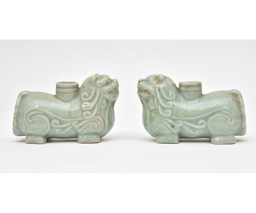 Appraisal: Pair of Chinese Celadon Dog Form Candlesticks Pair of Chinese