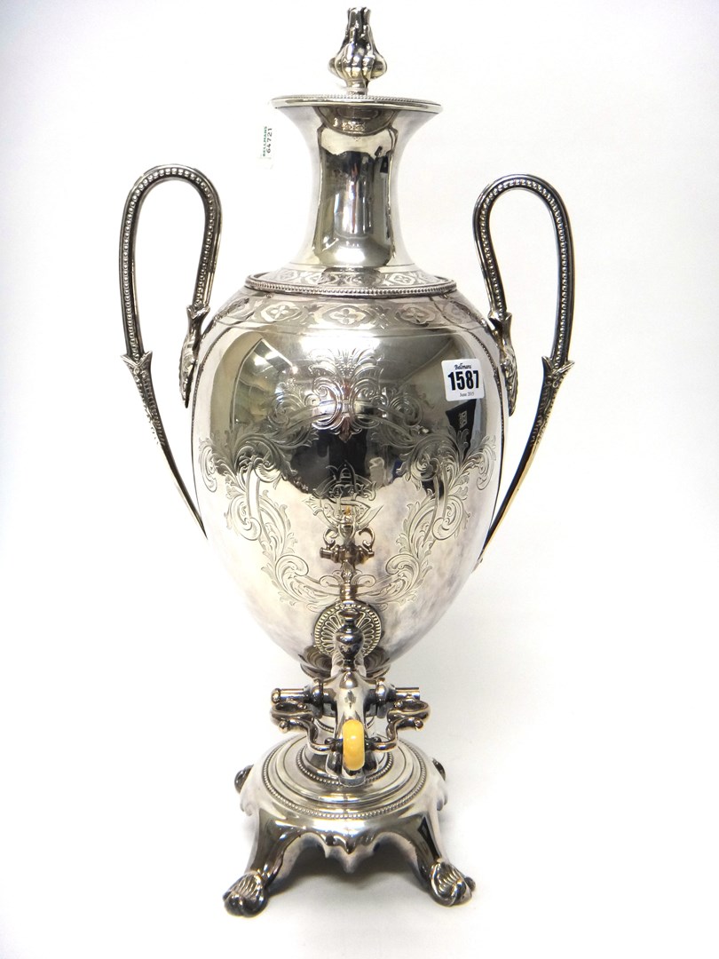 Appraisal: A Victorian plated twin handled tea urn fitted with a