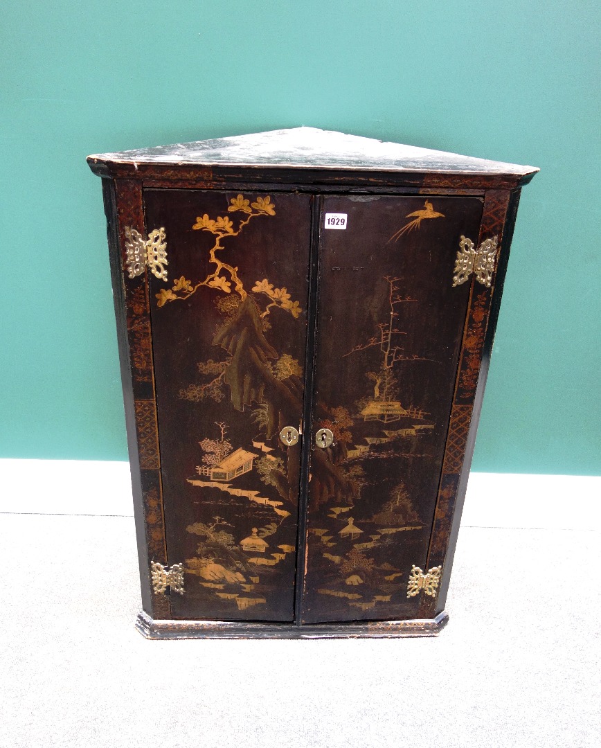 Appraisal: An th century black lacquer chinoiserie decorated hanging two door