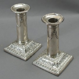 Appraisal: A pair of small column-form sterling silver candlesticks by Thomas