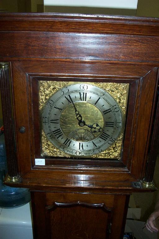 Appraisal: A Georgian oak cottage longcase clock the shaped door with