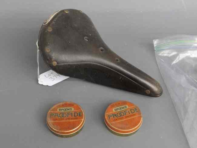 Appraisal: Brooks ''B '' saddle with tins of Brooks ''Proofide'' leather