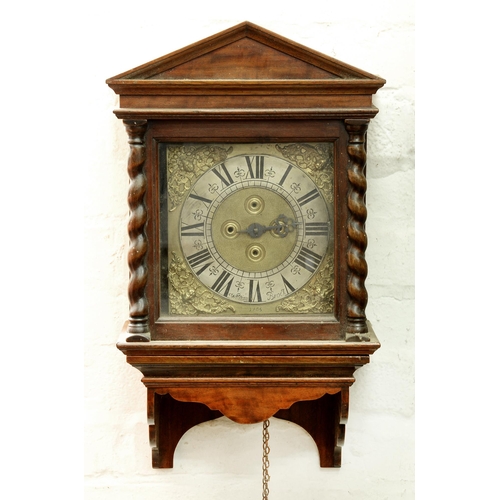 Appraisal: An English walnut thirty hour hooded wall clock William Brock