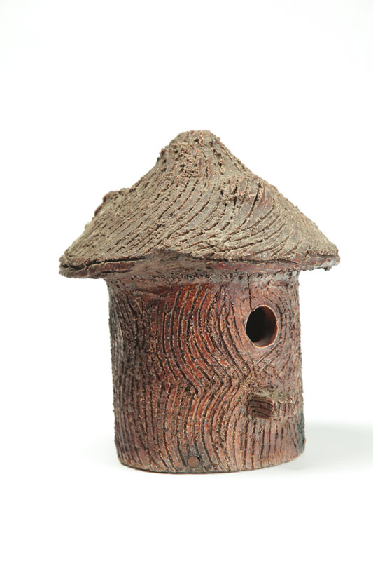 Appraisal: SEWERTILE BIRDHOUSE American early th century Hand tooled tree bark