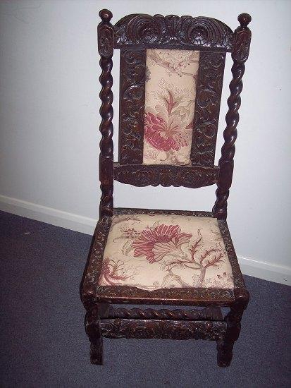 Appraisal: A th Century oak framed chair the carved crest rail