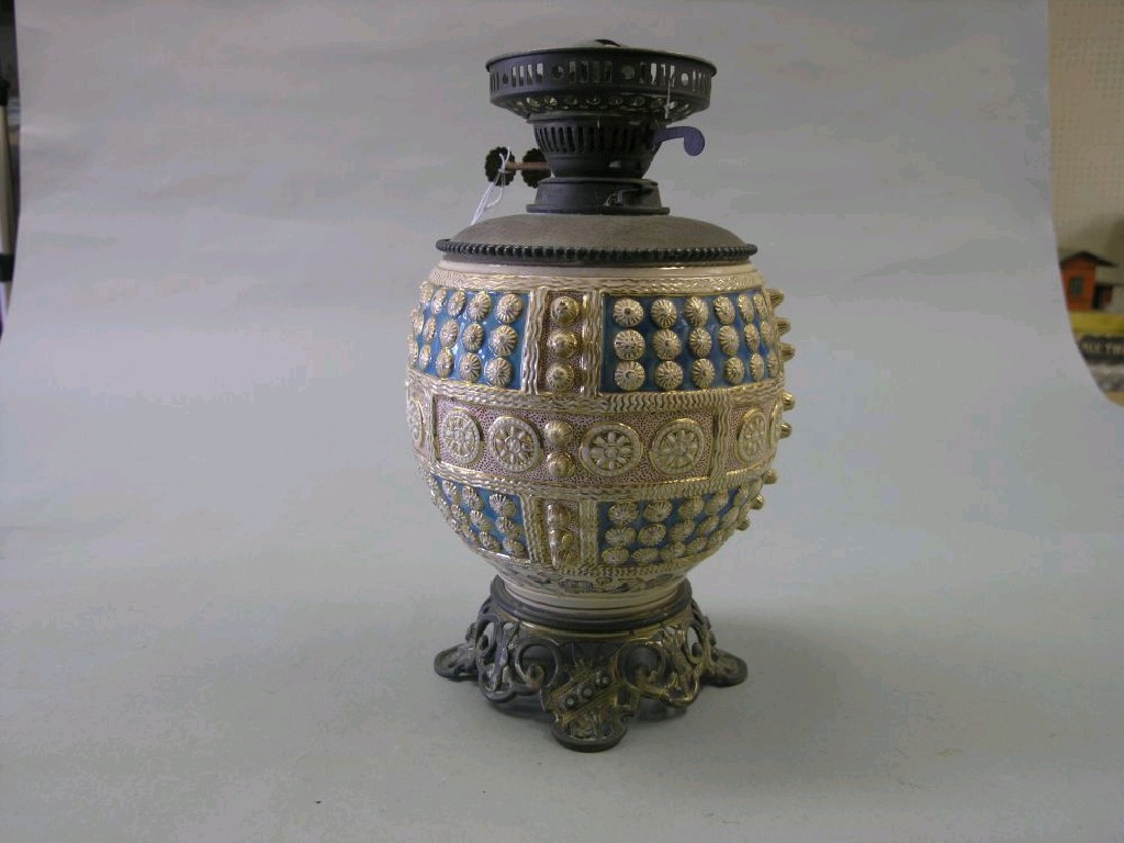 Appraisal: A Fischer Budapest earthenware and brass mounted oil lamp globular