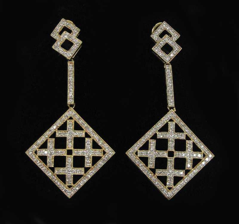 Appraisal: PAIR OF LAURA RAMSEY DIAMOND DANGLE EARRINGS each omega back