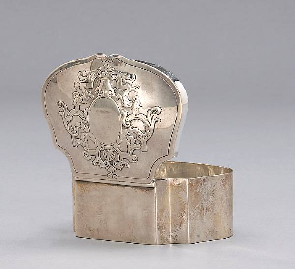 Appraisal: A silver cartouche form table box with heraldic decorationBearing marks