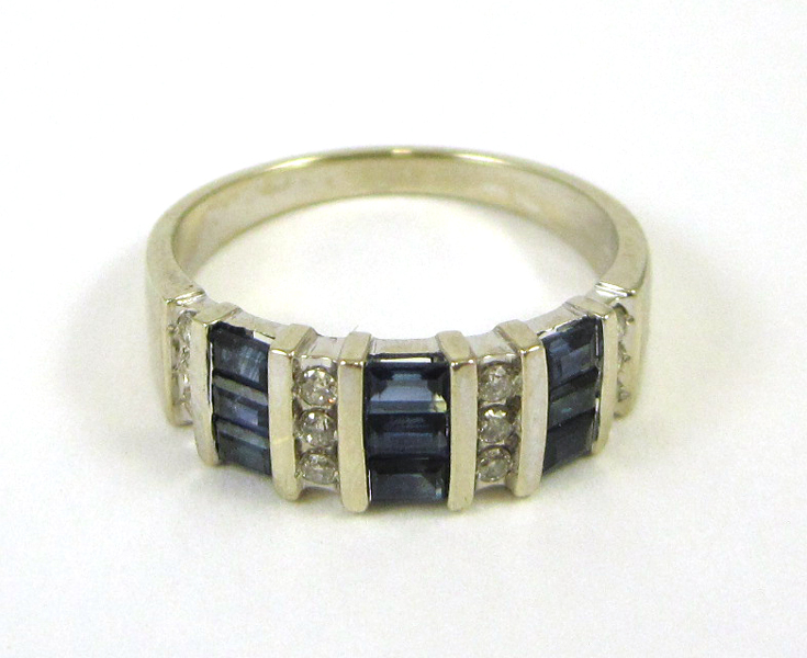 Appraisal: SAPPHIRE DIAMOND AND FOURTEEN KARAT GOLD RING set with nine