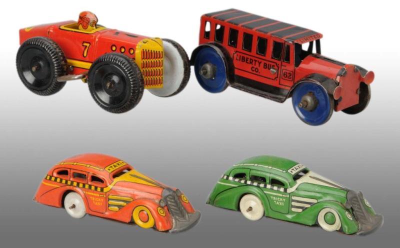 Appraisal: Lot of Marx Wind-Up Friction Vehicle Toys Description Working Includes