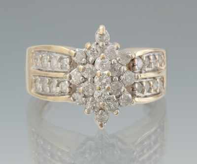 Appraisal: A Ladies' Diamond Cluster Ring k yellow gold ring featuring