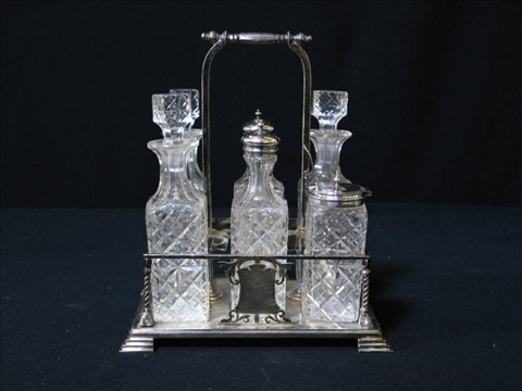 Appraisal: SILVER PLATE AND GLASS CRUET SET The rectangular stand with