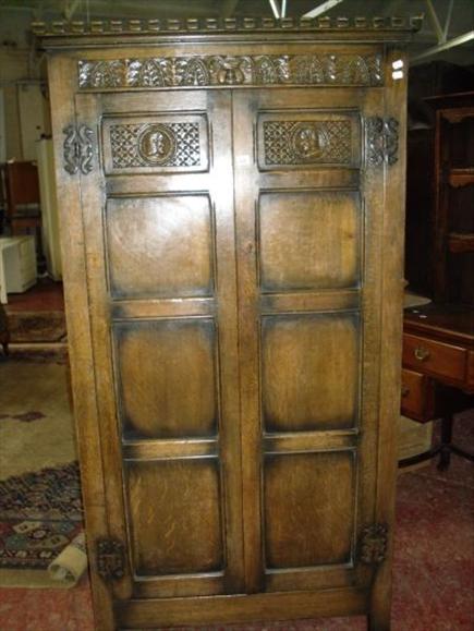 Appraisal: An 'Ispswich oak' wardrobe of panelled construction