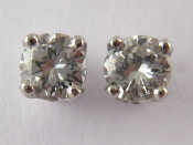 Appraisal: A pair of carat white gold round brilliant cut diamond