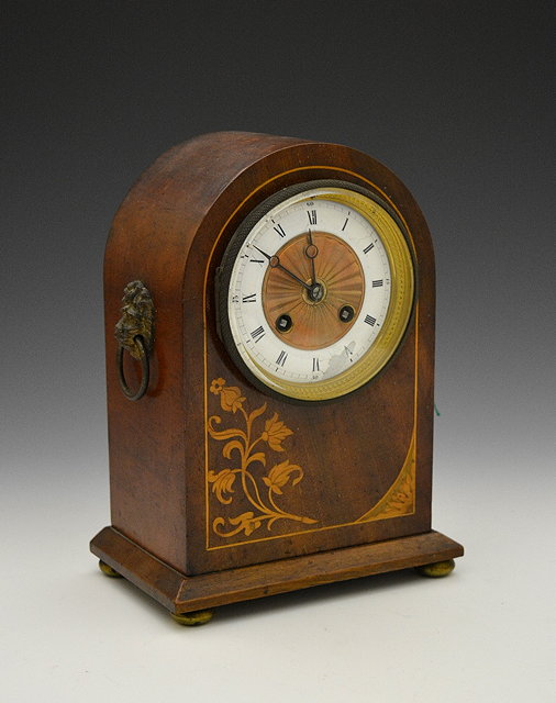 Appraisal: An Edwardian mahogany and inlaid mantel clockwith striking mechanism