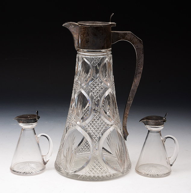 Appraisal: A SILVER MOUNTED GLASS CLARET JUG of tapering form with