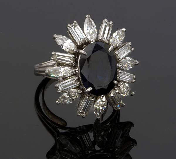 Appraisal: A sapphire and diamond ring centering an oval-shaped sapphire measuring