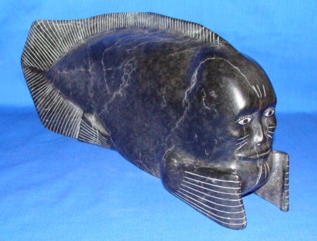 Appraisal: INUIT ARTIST Transformation Sculpture of a Man Fish H in