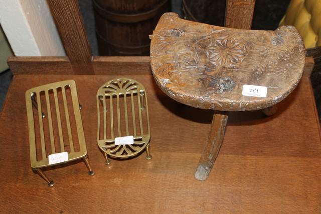 Appraisal: A CONTINENTAL STOOL with carved decoration and tripod base together