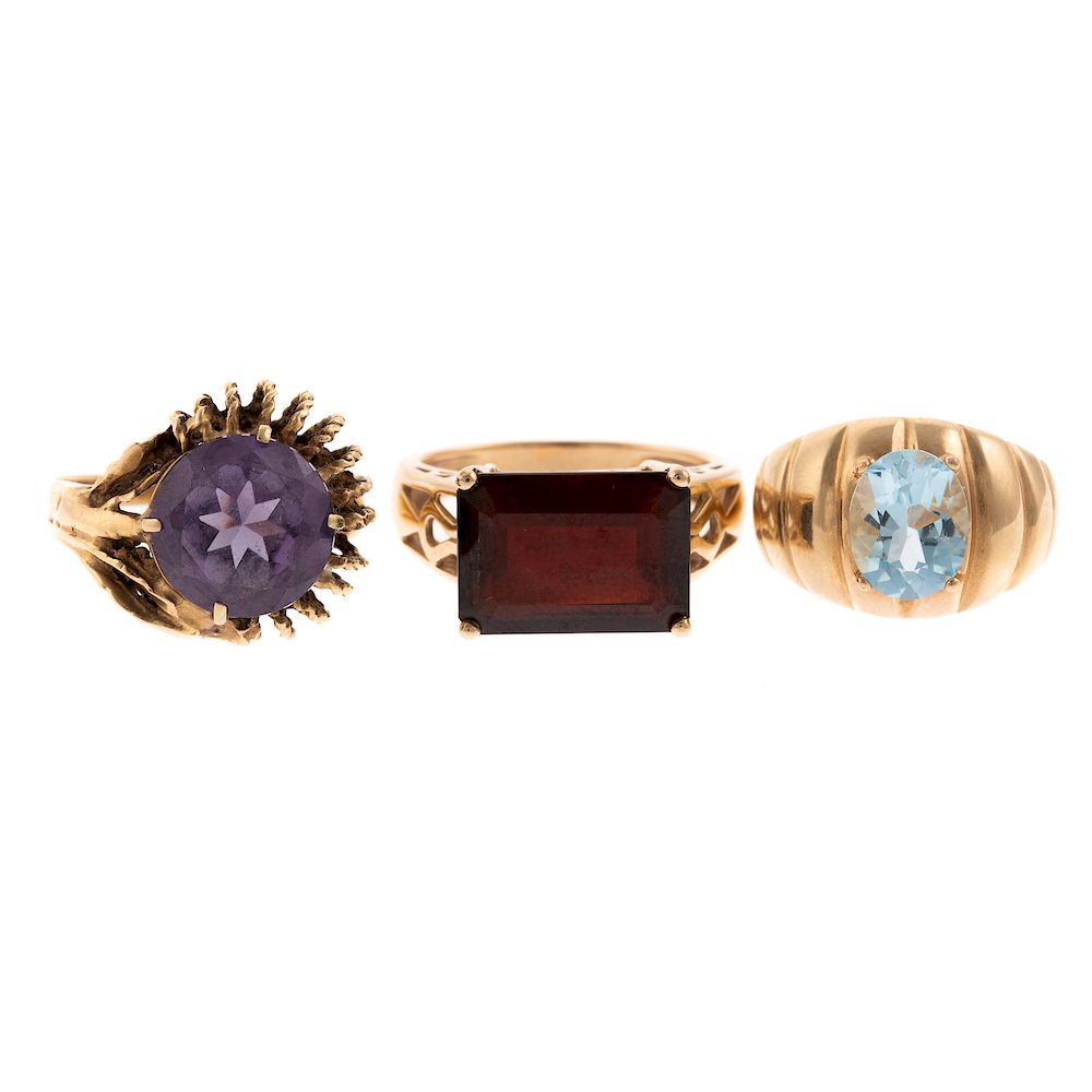 Appraisal: A Trio of Large Gemstone Rings in Gold K yellow