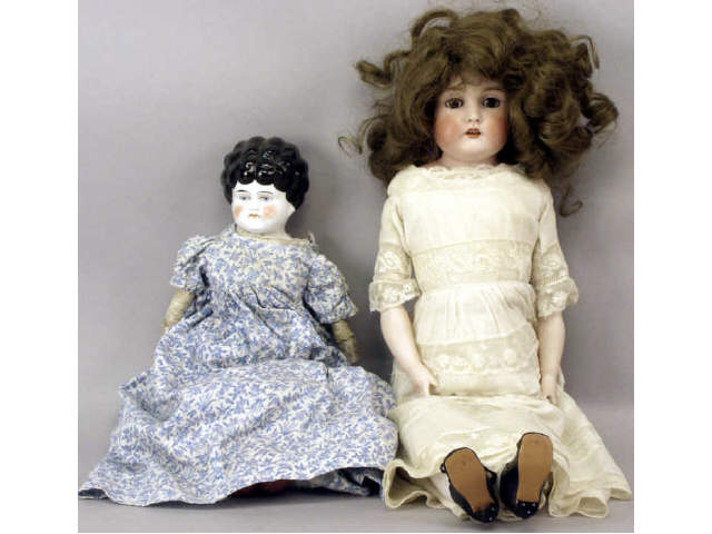 Appraisal: Collection of antique dolls including a porcelain head shoulder doll