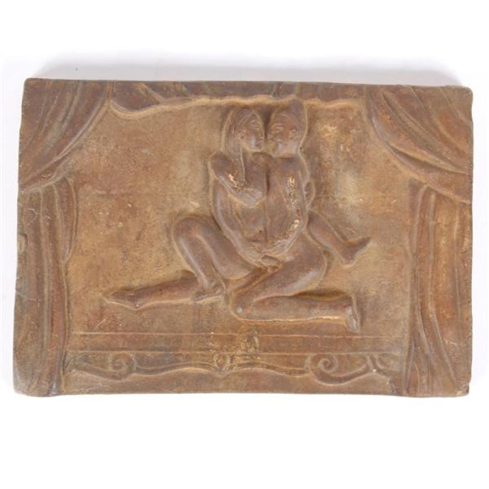 Appraisal: AN INDIAN CARVED EARTHENWARE PANEL FRIEZE DEPICTING AN EROTIC SCENE