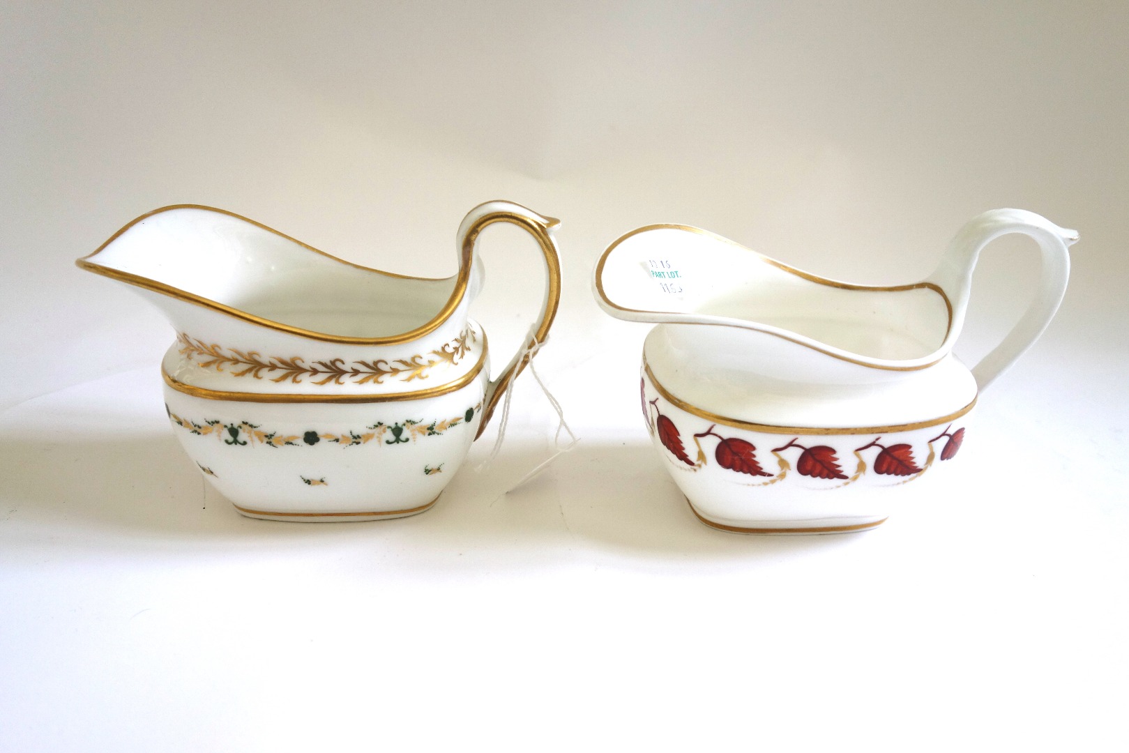 Appraisal: A Swansea porcelain milk jug and a Nantgarw milk jug