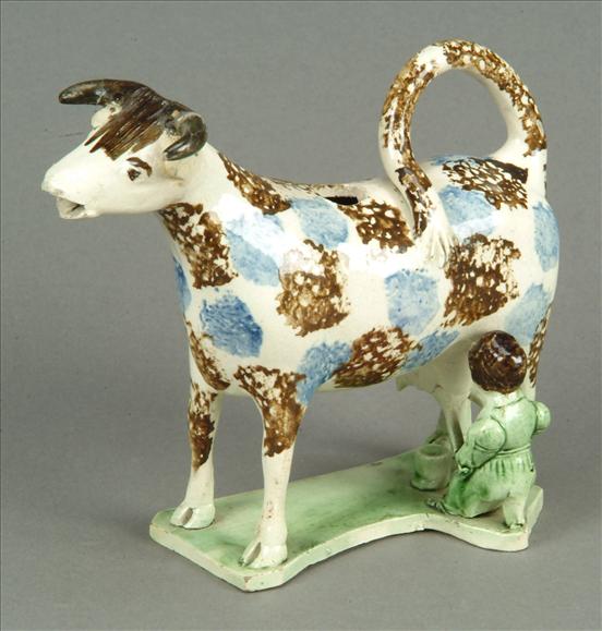 Appraisal: An English pearlware cow-creamer Staffordshire or Yorkshire typically modelled being