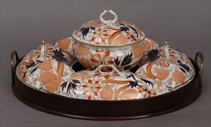 Appraisal: FIVE ENGLISH POTTERY SERVING DISHES AND COVERS FITTED INTO A