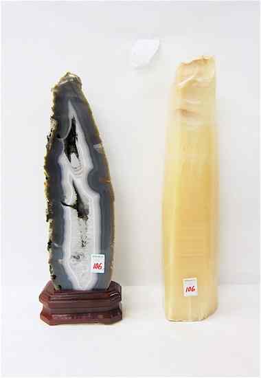 Appraisal: TWO NATURAL STONE SCULPTURES polished marble stalagmite with hole drilled