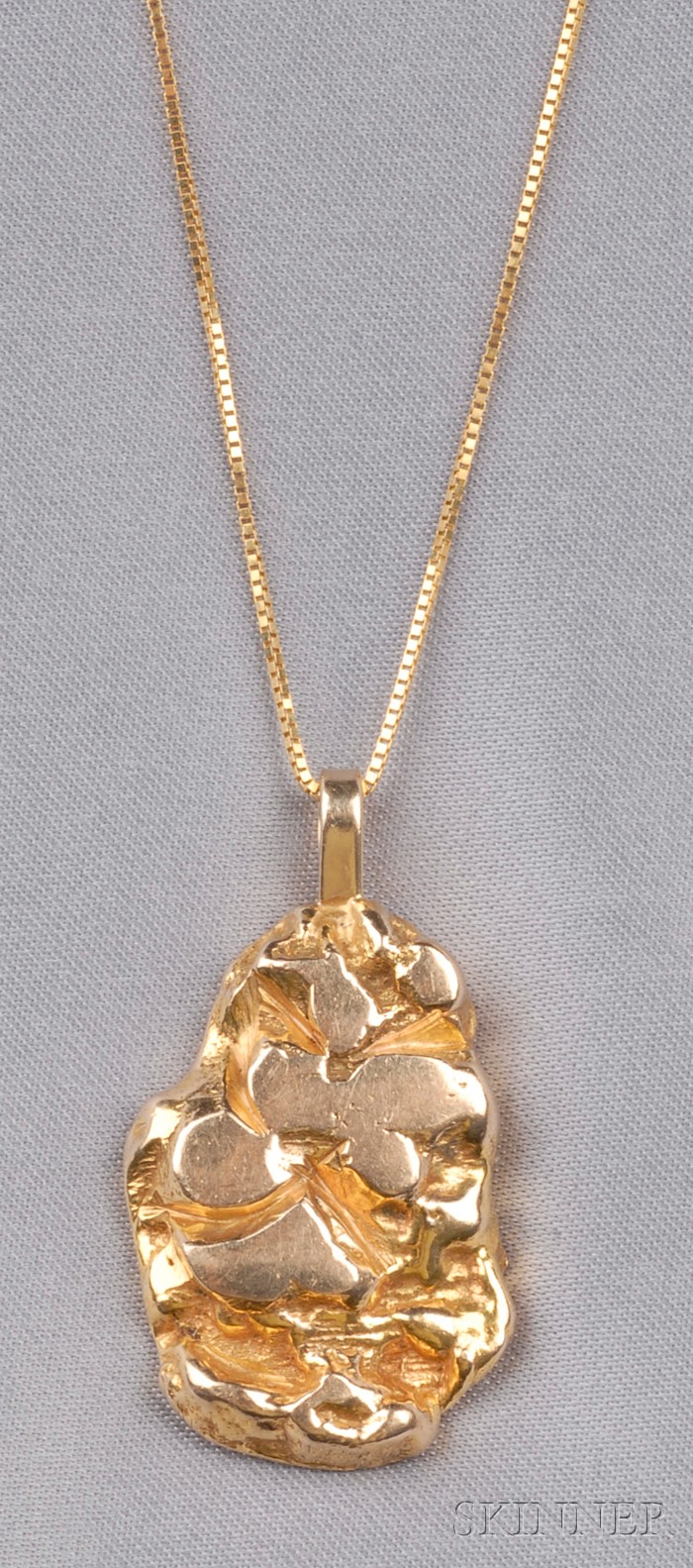 Appraisal: kt Gold Pendant designed as a gold nugget suspended from