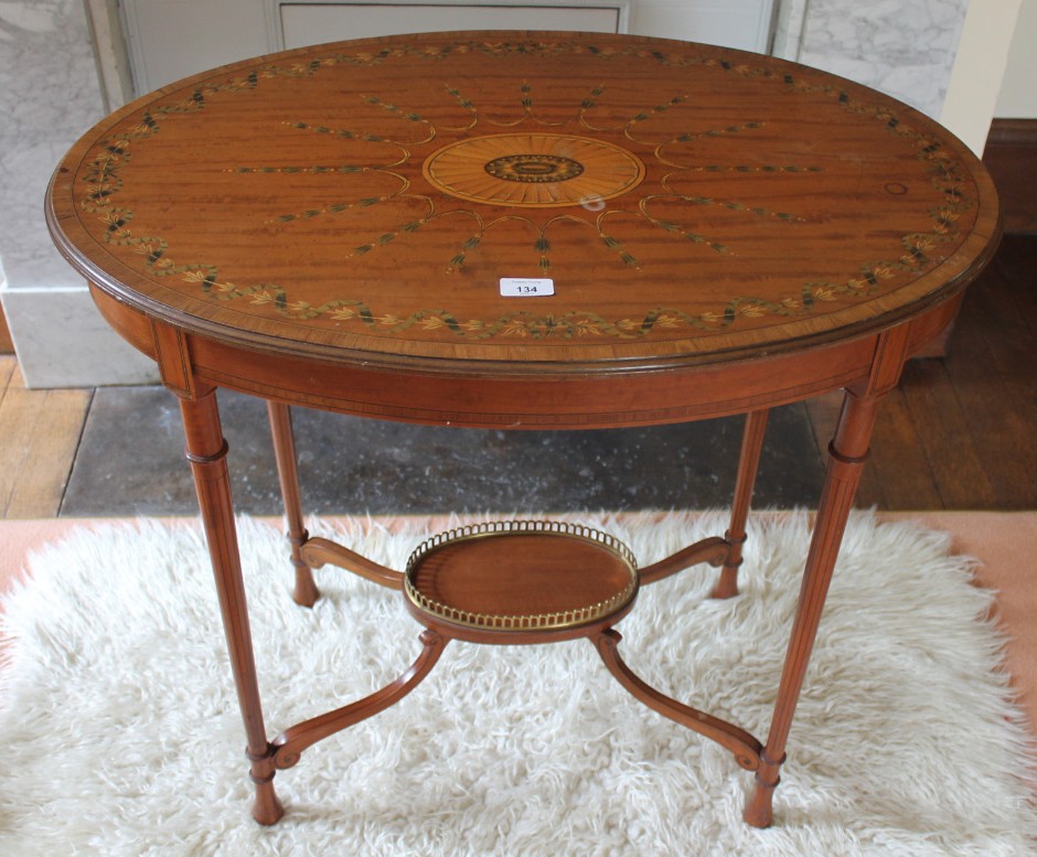 Appraisal: An Edwardian satinwood Sheraton revival occasional table with crossbanded top