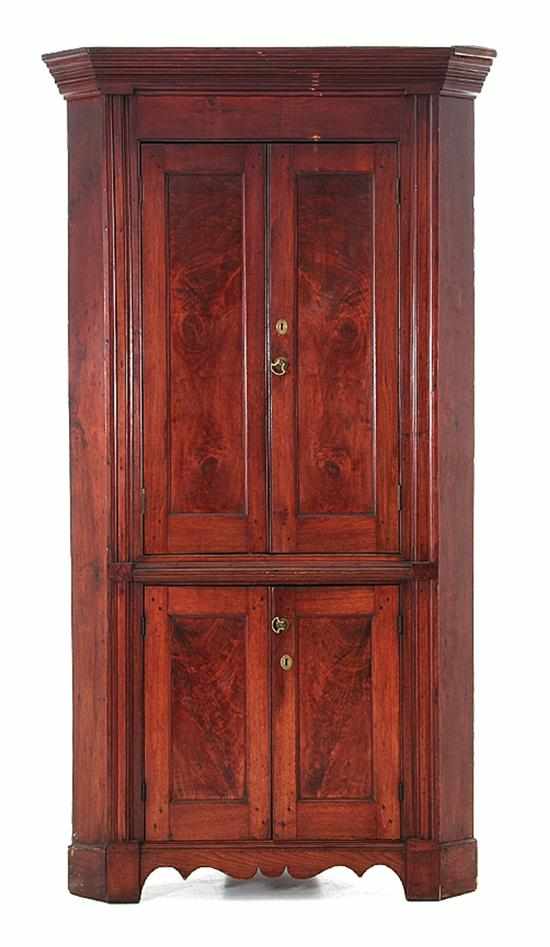 Appraisal: American mahogany corner cupboard circa molded cornice upon straight frieze